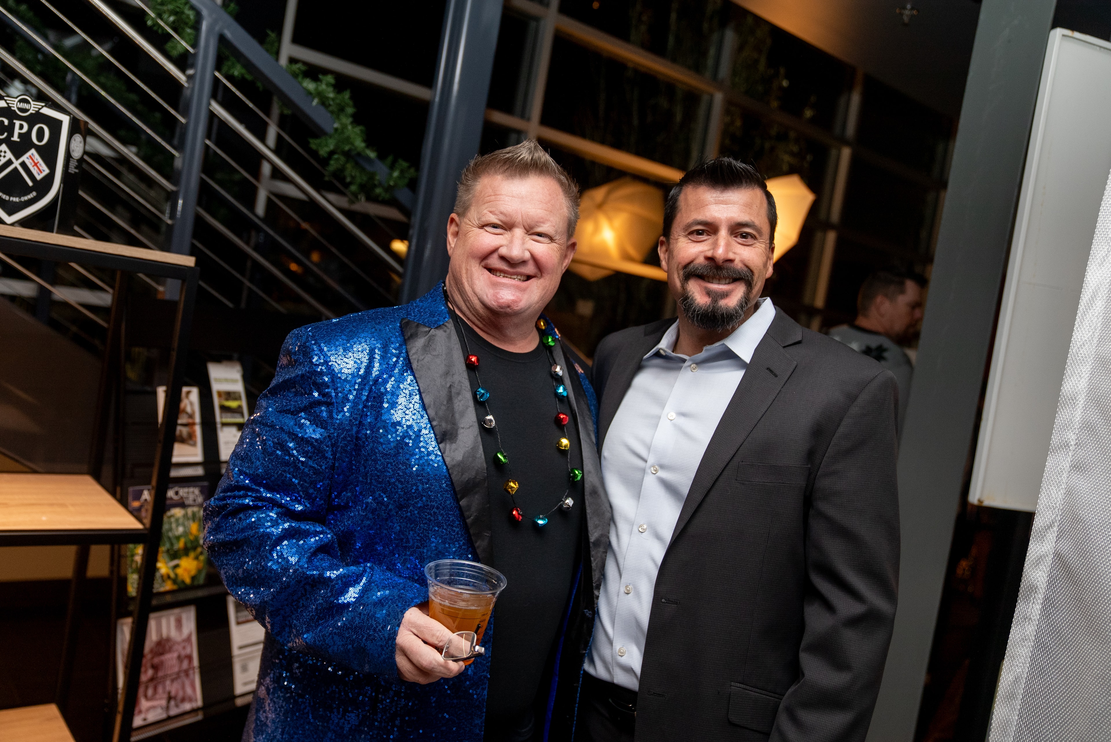 Two men posing at the festive event
