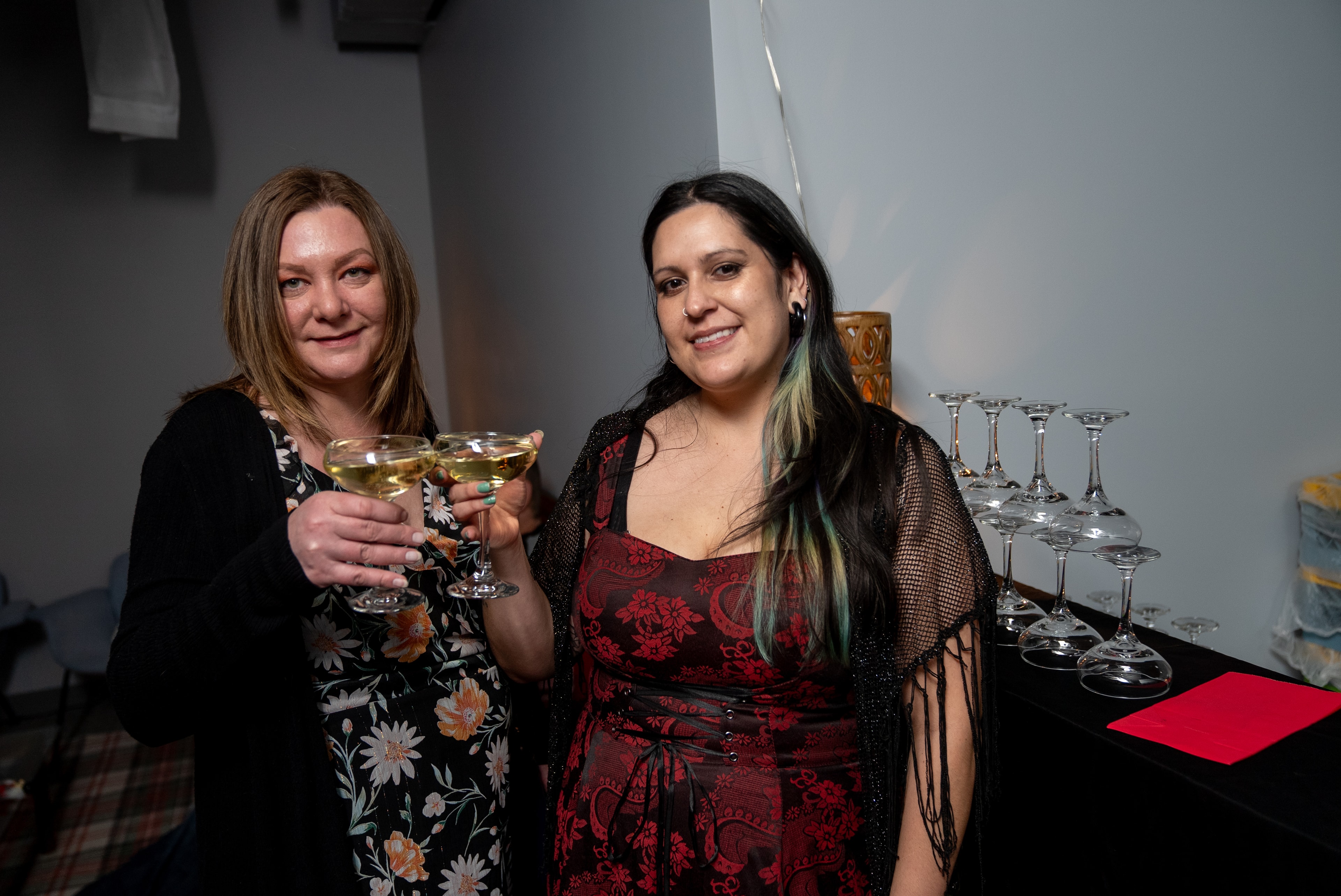 Two women toasting with cocktails