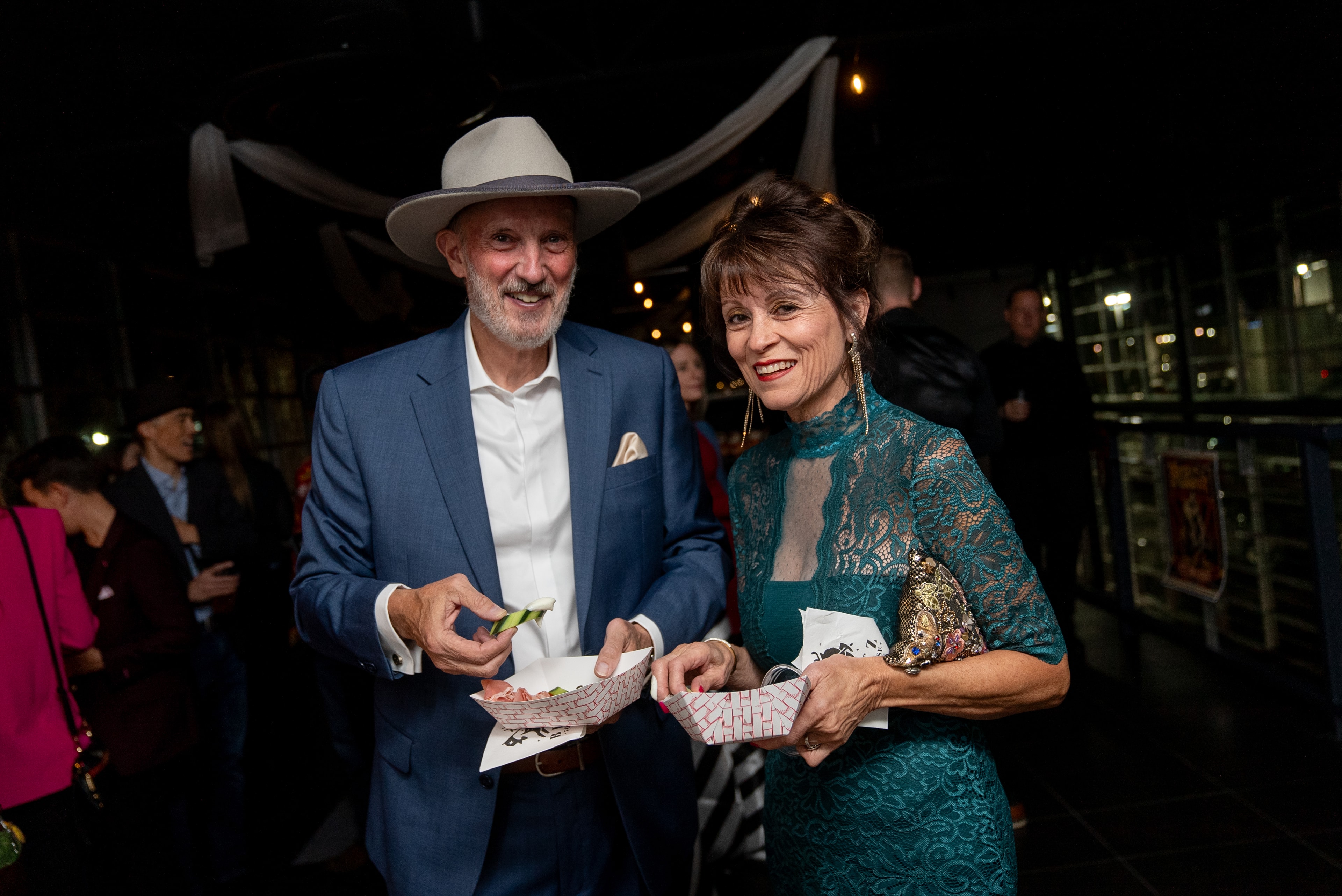 Couple enjoying food at the night event