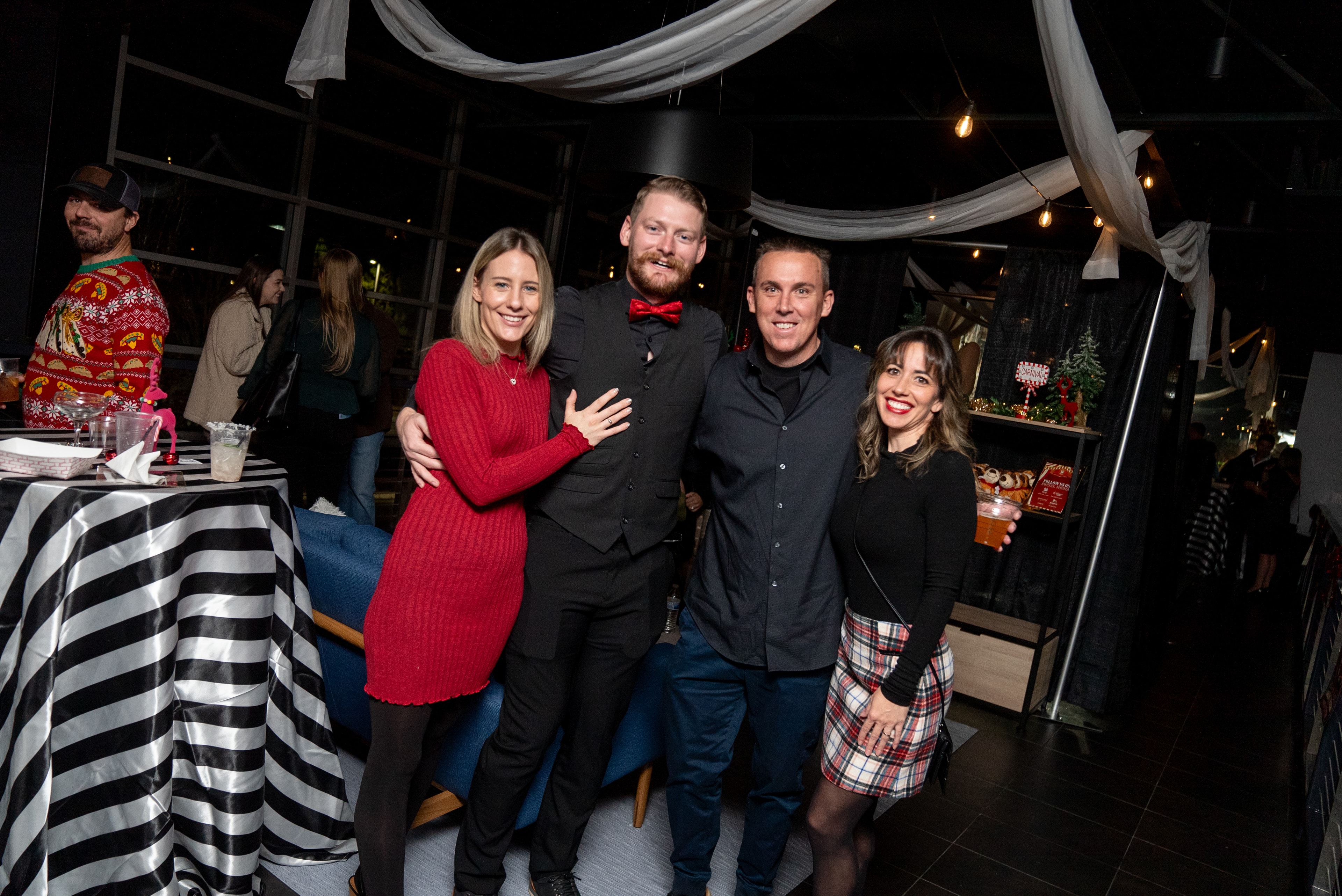 Friends posing at the festive holiday party