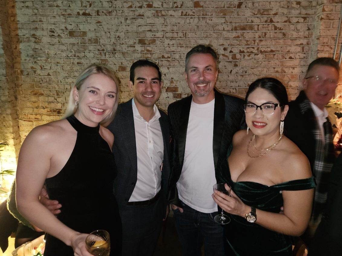 Group of friends posing at formal event