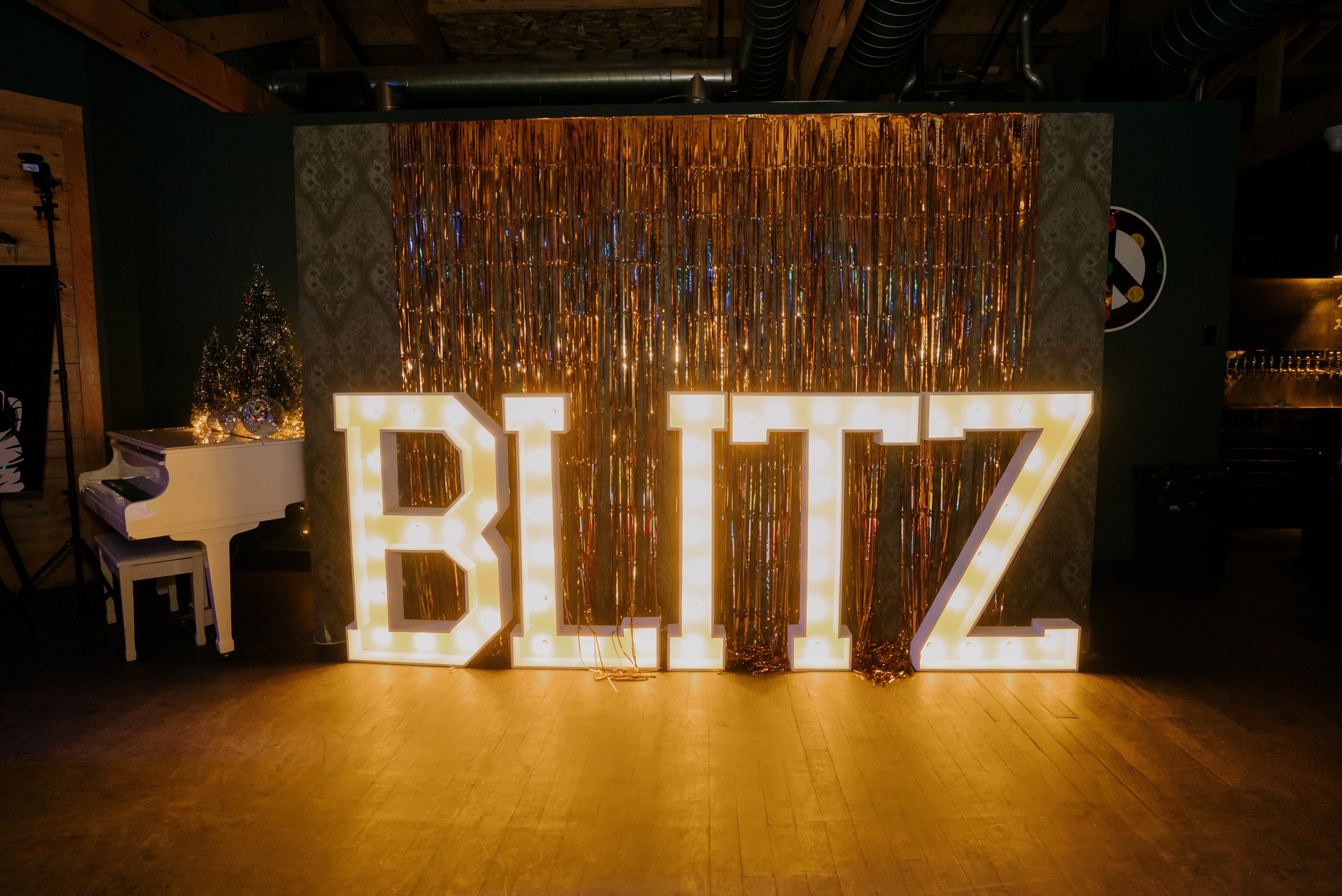 Illuminated Blitz sign at event venue stage
