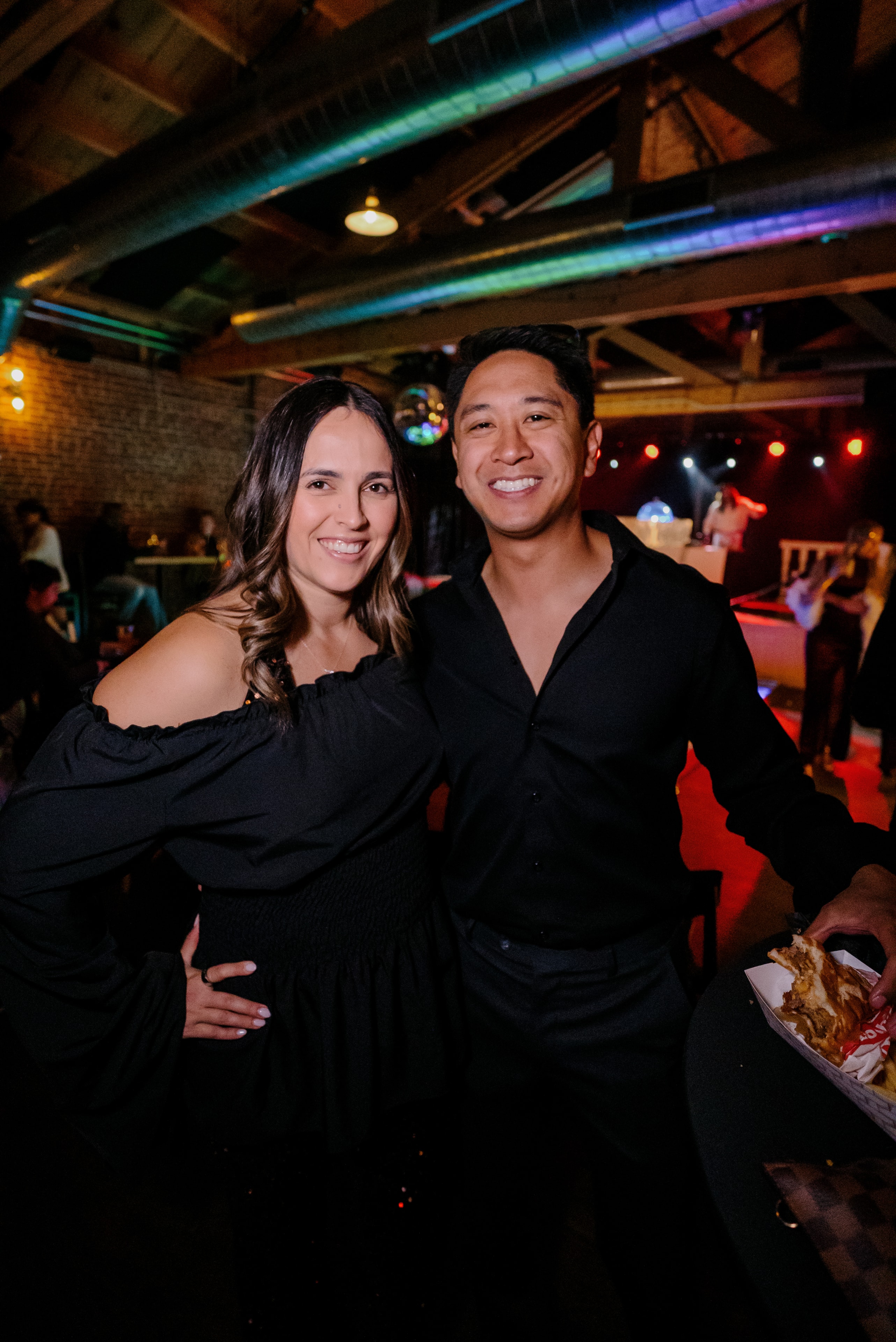 Couple smiling at nightclub event